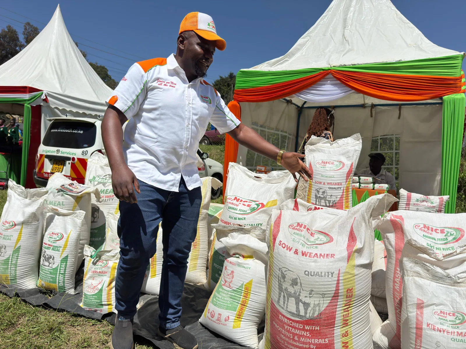 Nice Choice Mkombozi animal feed bags displayed by a Nice Extra Premium sales agent