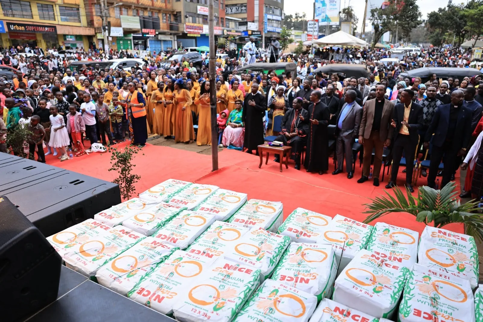 Bales of Nice Extra Premium maize flour prepared for a community donation event